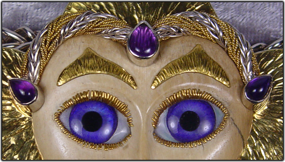 The eyes on this exotic face are made from clear quartz and white mother-of-pearl. 
