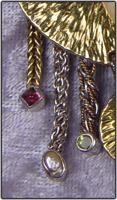 Jeweled pendant with D’Anna Chain earrings.