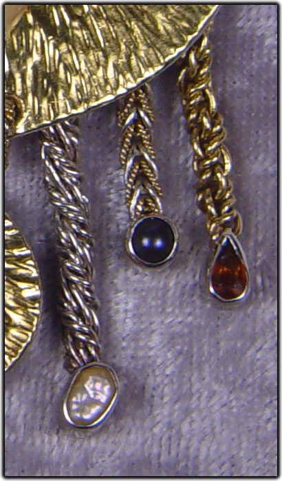 Jeweled pendant with D’Anna Chain earrings.